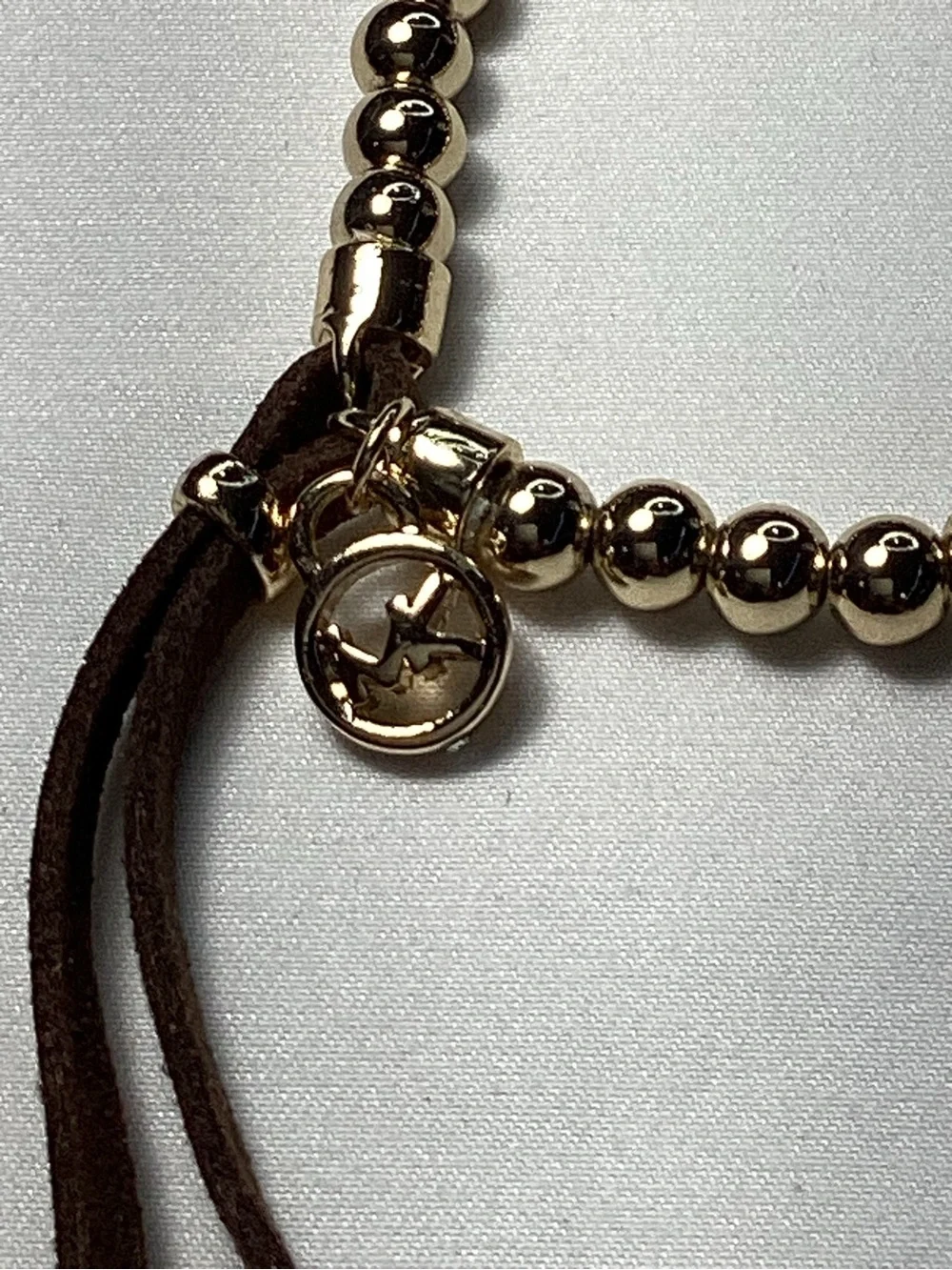 Michael Kors NWT and Dust Bag Gold-Tone Beaded Brown Suede Logo Charm Bracelet